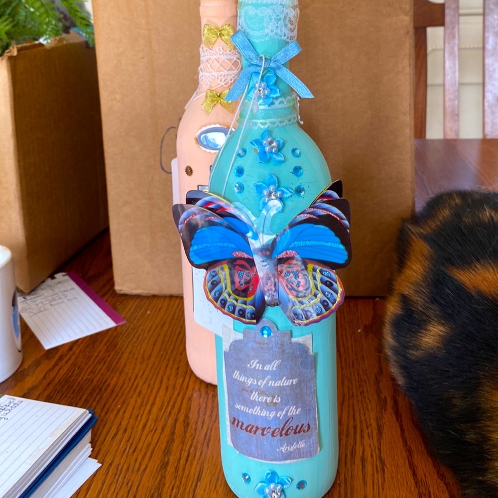 Hand painted and beautifully decorated wine bottles and vases.